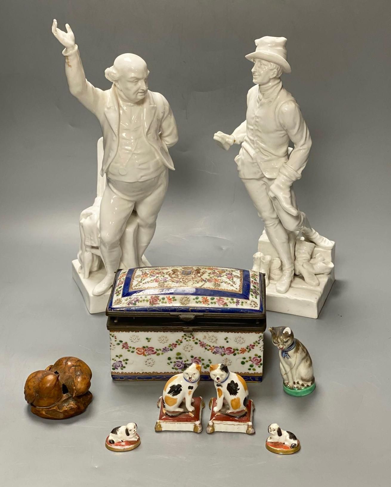 Two Crown Derby white glazed figures, 30 and 32.5cm, a group of Continental ceramics and a carved nut group